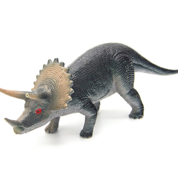 Vintage triceratops dinosaur figurine. Figure toy. Plastic figurine. Herbivorous dinosaur. Cretaceous.