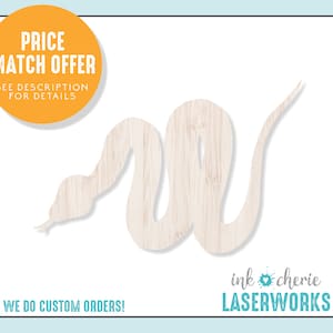May include: A wooden cutout of a snake in a light brown color. The snake is curled up in a relaxed pose. The text "ink cherie LASERWORKS" is visible in the bottom right corner of the image.