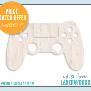 May include: A wooden cutout of a video game controller in a light wood color. The text "ink cherie LASERWORKS" is at the bottom of the image.