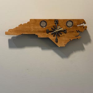 North Carolina State Quarter Clock. Handmade. Clocks can be made of pine, red cedar, oak, cherry, and black walnut.
