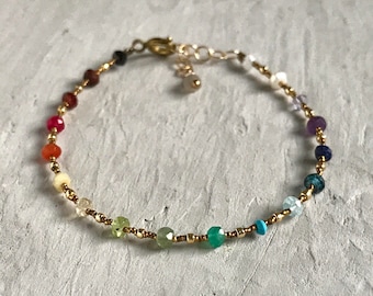 tiny gemstone chakra bracelet with gold beads