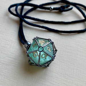 removable D20 dice necklace in blackened brass