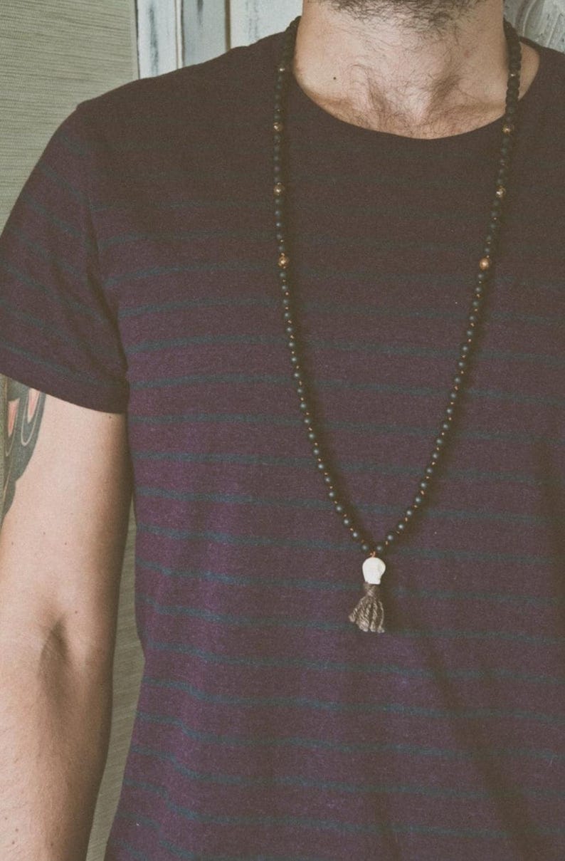 Black Kali Mala Necklace worn by a man • Lava & Bronzite 108 Beads Yak Wool Meditation beads • Carved Bone Skull Jewelry
