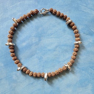 RUDRAKSHA and COWRIE SHELLS short necklace with toggle closure image 1