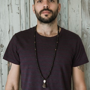 Black Kali Mala Necklace worn by a man • Lava & Bronzite 108 Beads Yak Wool Meditation beads • Carved Bone Skull Jewelry