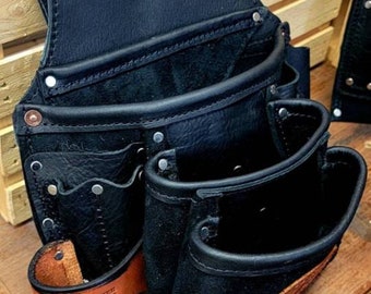 May include: Black leather tool belt with multiple pockets and a brown leather strap with the text "Granger Leather Goods" on it.
