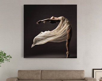 May include: A ballerina in a white flowing dress poses against a dark background. The dress is billowing in the air as she dances.