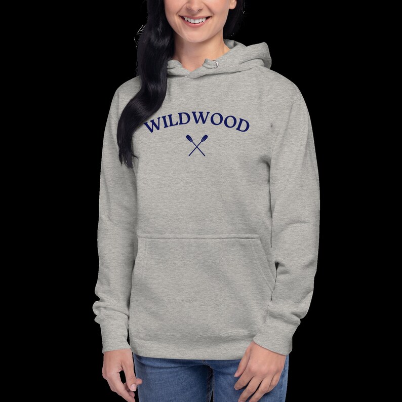 May include: A heather gray hooded sweatshirt with the text "WILDWOOD" in navy blue lettering and two crossed oars underneath.