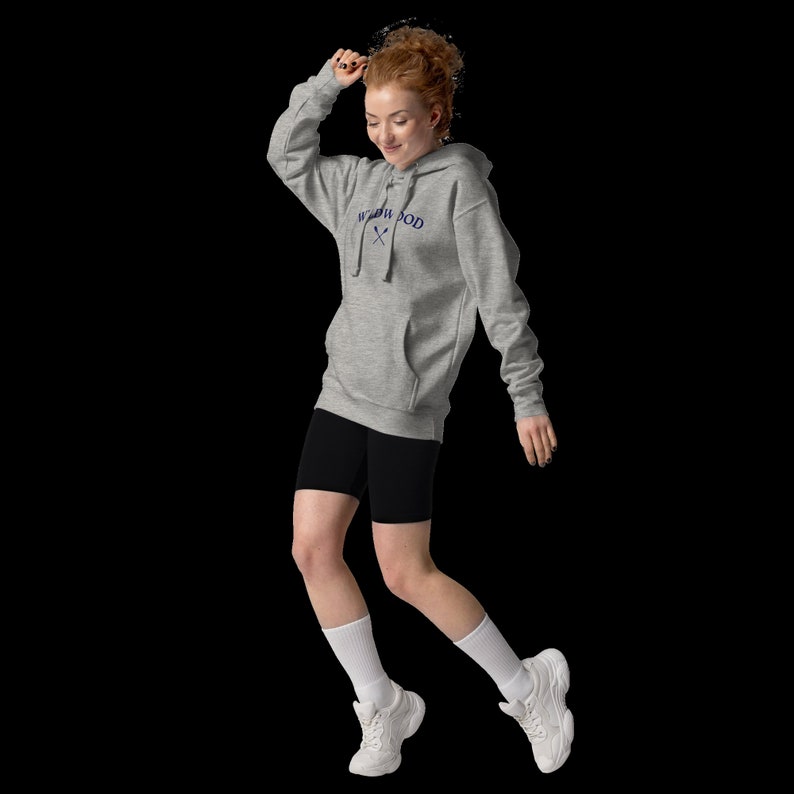 May include: A gray hooded sweatshirt with the text "Neighborhood" and a crossed fork and spoon design in navy blue.
