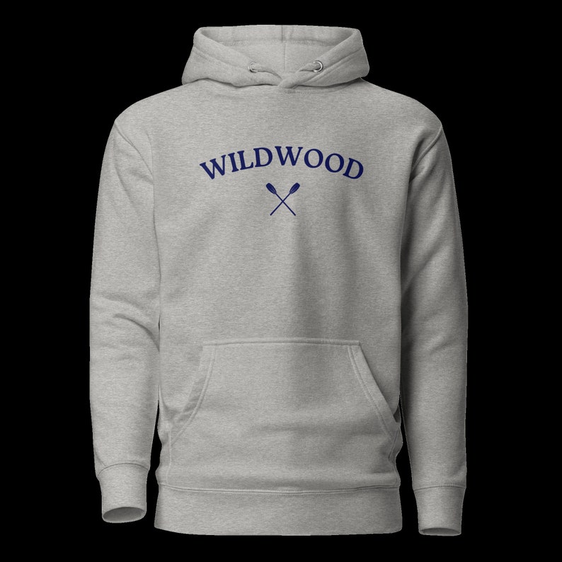 May include: A gray hooded sweatshirt with the text "WILDWOOD" in blue lettering and a pair of crossed oars in blue.