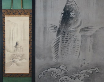 May include: A black and white ink painting on a scroll depicting a carp swimming upwards in a waterfall. The carp is detailed with scales and has a large, open mouth. The waterfall is depicted with flowing lines and the background is a light gray.