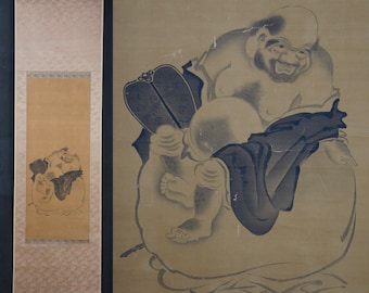 May include: A black and white ink painting on a scroll depicting a large, smiling, bald man with a beard, holding a smaller figure in his lap. The man is wearing a robe and the smaller figure is wearing a long, flowing garment. The painting is set against a light brown background.