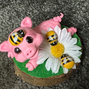 Piglet with daisy and bees handmade sculpture