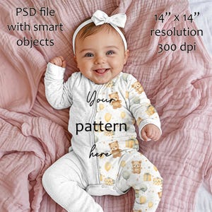 May include: A baby wearing a white onesie with a teddy bear pattern, a white bow headband, and lying on a pink blanket. The onesie has a zipper and the text "Your pattern here". The image resolution is 14" x 14" at 300 dpi.
