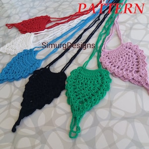 May include: A collection of six crocheted bags in various colours, including red, white, blue, black, green, and pink. The bags are all in the shape of a teardrop and have a long strap.