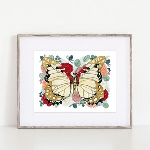 May include: A framed watercolour painting of a butterfly with gold and black markings surrounded by red, pink, and white flowers and green leaves.
