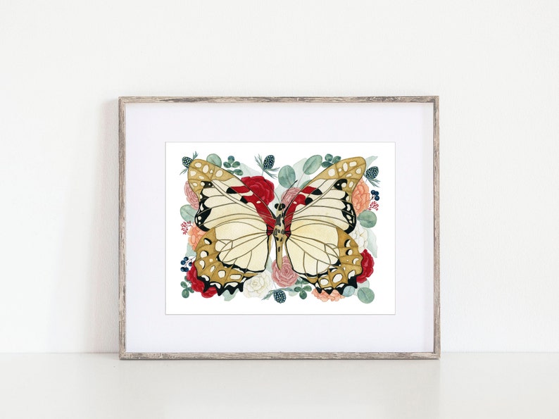 May include: A framed watercolour painting of a butterfly with gold and black markings surrounded by red, pink, and white flowers and green leaves.