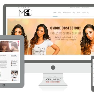May include: A website homepage for a beauty salon and hair extension business. The website features a banner image with the text "OMBR&Egrave; OBSESSION!! EXCLUSIVE CUSTOM CLIP-INS Natural ombr&eacute; look that's quick and easy to apply!" and a model with long ombre hair. The website also features a blog post titled "Loving Your Hair Just Got Easier".