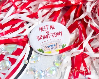 MADDYMARIEPAINTS &quot;Meet Me at Bryant-Denny&quot; OFFICIALLY LICENSED University of Alabama® 2.25&quot; Gameday Button | The Original Pink Gameday™