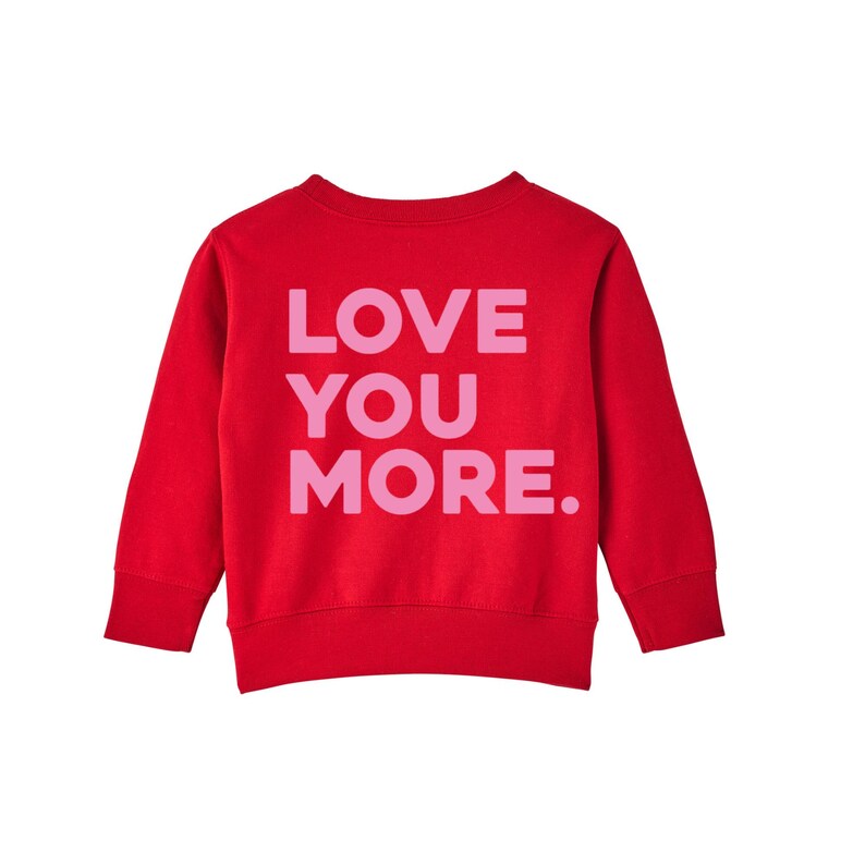 May include: Red sweatshirt with long sleeves and a pink graphic that says "LOVE YOU MORE."