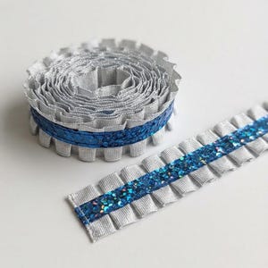Ruffled silver and royal blue glitter for homecoming mum, homecoming loop braids