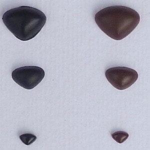 May include: Five pairs of plastic safety eyes in different sizes. The eyes are black and brown and have a triangular shape.