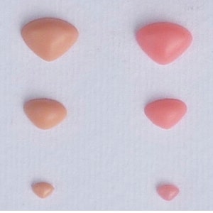May include: Five different sizes of pink and peach colored triangle shaped fabric patches.