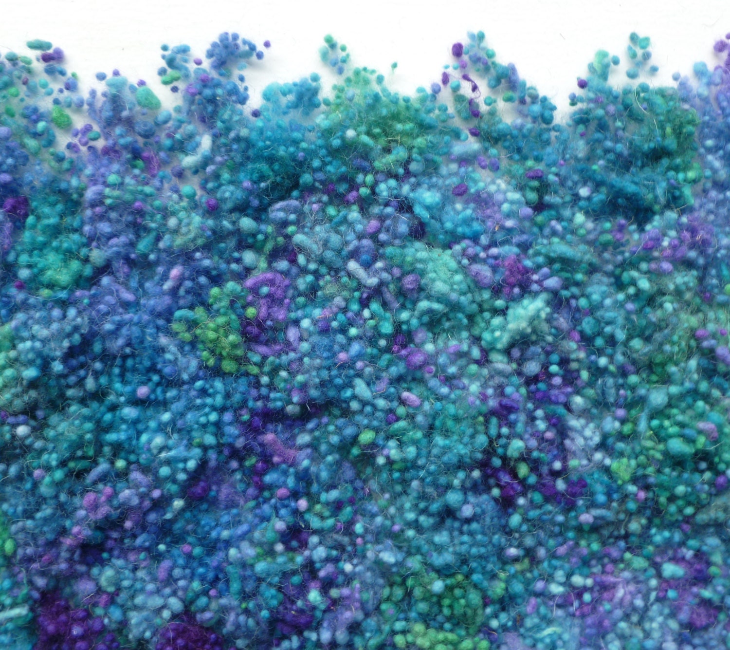 Hand-dyed blue/purple/green wool nepps