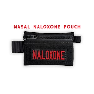 May include: Black nasal naloxone pouch with a zipper closure and a Velcro strap. The word "NALOXONE" is embroidered in red on the front. The text "NASAL NALOXONE POUCH" is displayed in red above the pouch.