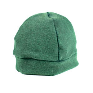 May include: A green fleece beanie hat with a folded brim.