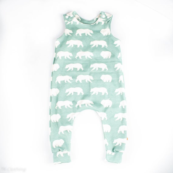 green dungarees baby