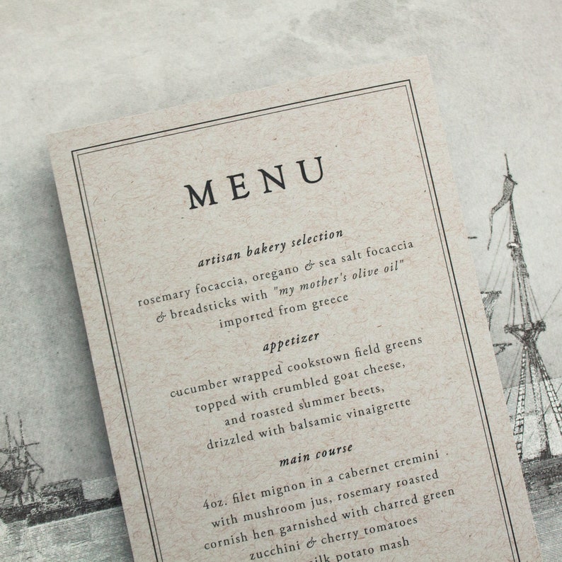 May include: A rustic menu card with a black border and the word 'MENU' in large black letters. The menu lists artisan bakery selections, an appetizer, and a main course. The menu is printed on a textured, beige paper with a drawing of a ship in the background.