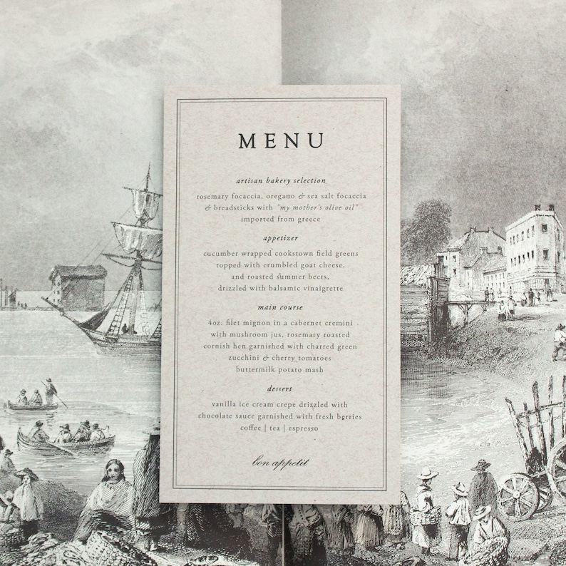 May include: A black and white menu card with the word 'MENU' printed in large, bold letters at the top. The menu lists artisan bakery selections, an appetizer, a main course, a dessert, and a closing statement 'bon appetit'. The menu card is printed on a textured, brown paper background. The background of the menu card is a black and white illustration of a cityscape with a river and boats.
