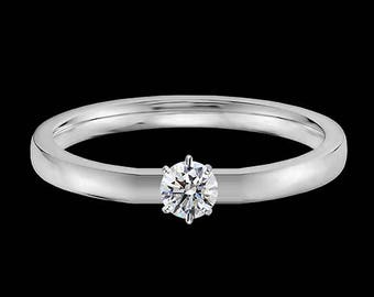 Lewi&#39;s 1/4 carat GIA certified diamond engagement ring in platinum.