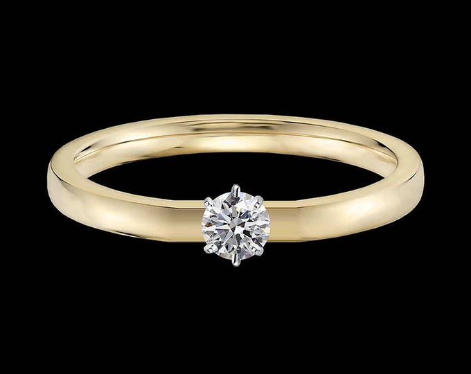 Lewi's 1/4 carat GIA certified diamond engagement ring in 18k yellow gold and 950 platinum prongs.