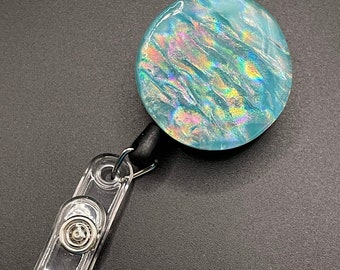 Fused glass retractable badge holder