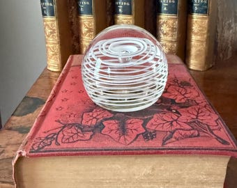Vintage clear Art Glass paperweight, orb with controlled white vortex, controlled bubble swirl, signed and dated.