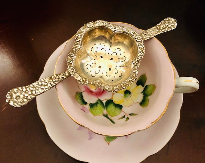 Stunning antique rococo tea-strainer by Dominick Haff