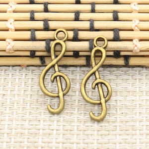 50 st. musiknotberlocker hängen 25 x 9 mm brons ornament tillbehör smyckestillverkning DIY handgjort hantverk basmaterial