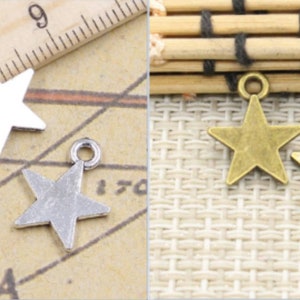 May include: Three silver star-shaped charms and two gold star-shaped charms. The charms have a loop at the top for attaching to jewelry or other crafts.