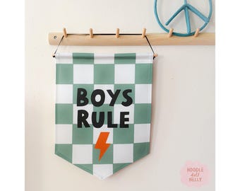 May include: A green and white checkered banner with the text "BOYS RULE" in black letters and a lightning bolt in orange.