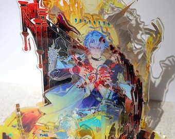 May include: A multi-layered acrylic standee featuring anime-style characters in a dynamic scene. The central figure has blue hair and a dark collar, with a larger golden-haired figure behind. Red and black architectural elements frame the design.