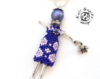 Purple beaded French doll necklace with a flower