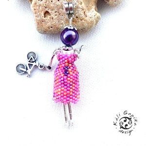 Vibrant pink Beaded french Doll pendant