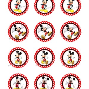 May include: Twelve round cupcake toppers featuring a cartoon image of Mickey Mouse in various poses. The toppers are red with white polka dots and a white scalloped edge.