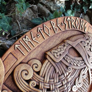 May include: A wooden plaque with a carved Viking helmet and the text "TIME TO BE STRONG" in runes.