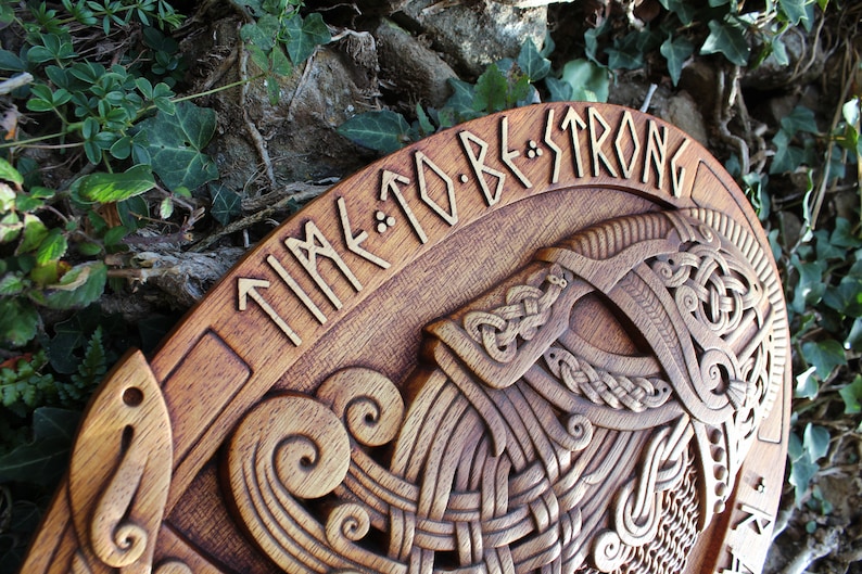 May include: A wooden plaque with a carved Viking helmet and the text "TIME TO BE STRONG" in runes.
