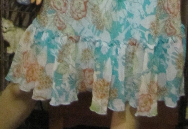 Darlin Aqua Floral Dress with Ruffled Hemline in size 78 Pretty B