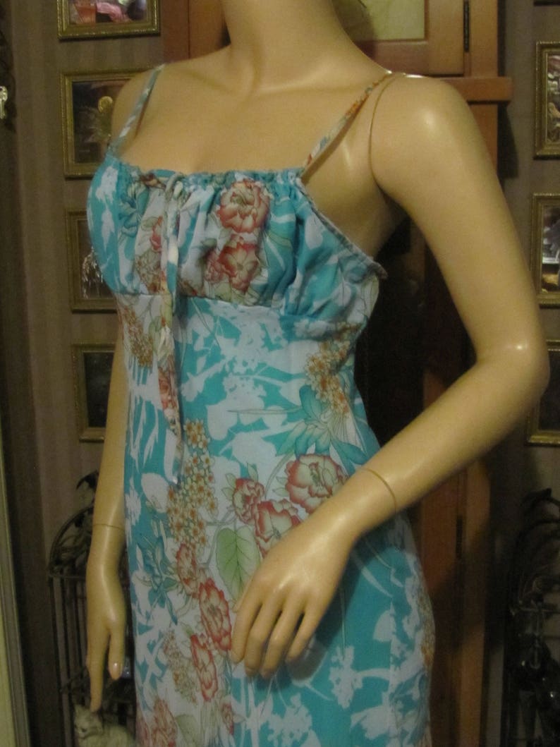 Darlin Aqua Floral Dress with Ruffled Hemline in size 78 Pretty B