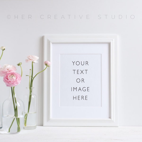 Styled Stock Photograph of a White Picture Frame with pink ranunculus. Product Mockup